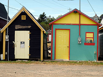 Painted fishing shacks at Parkers Cove