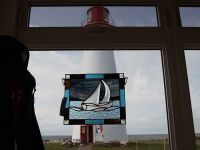 art-peice-with-lighthouse-backdrop