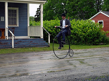 riding a penny farthing bike